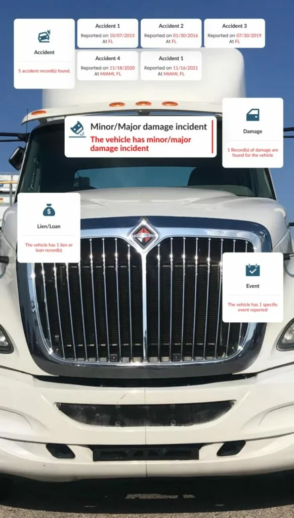 Truck front displaying detailed accident history by VIN with damage, lien, and event records.